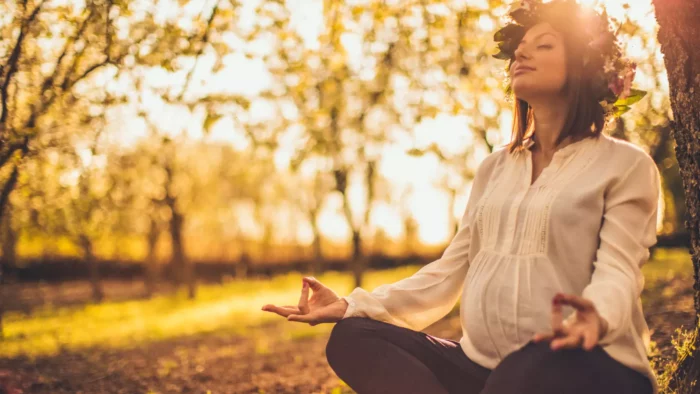 woman meditating in nature